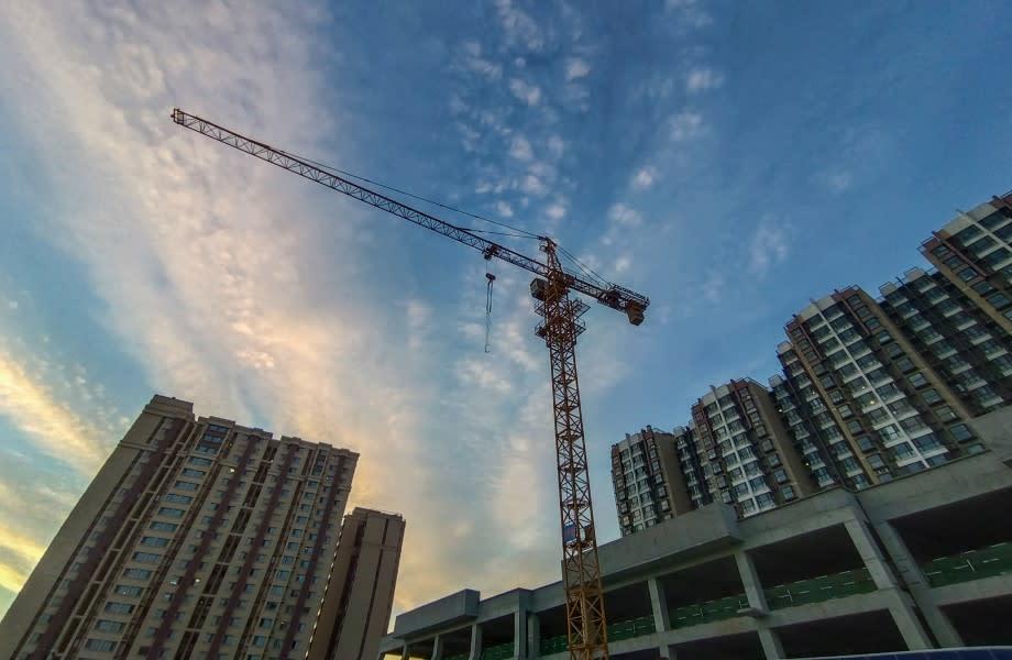 One of China's property development companies has filed for bankruptcy protection in the US while reporting losing less money than last year. 