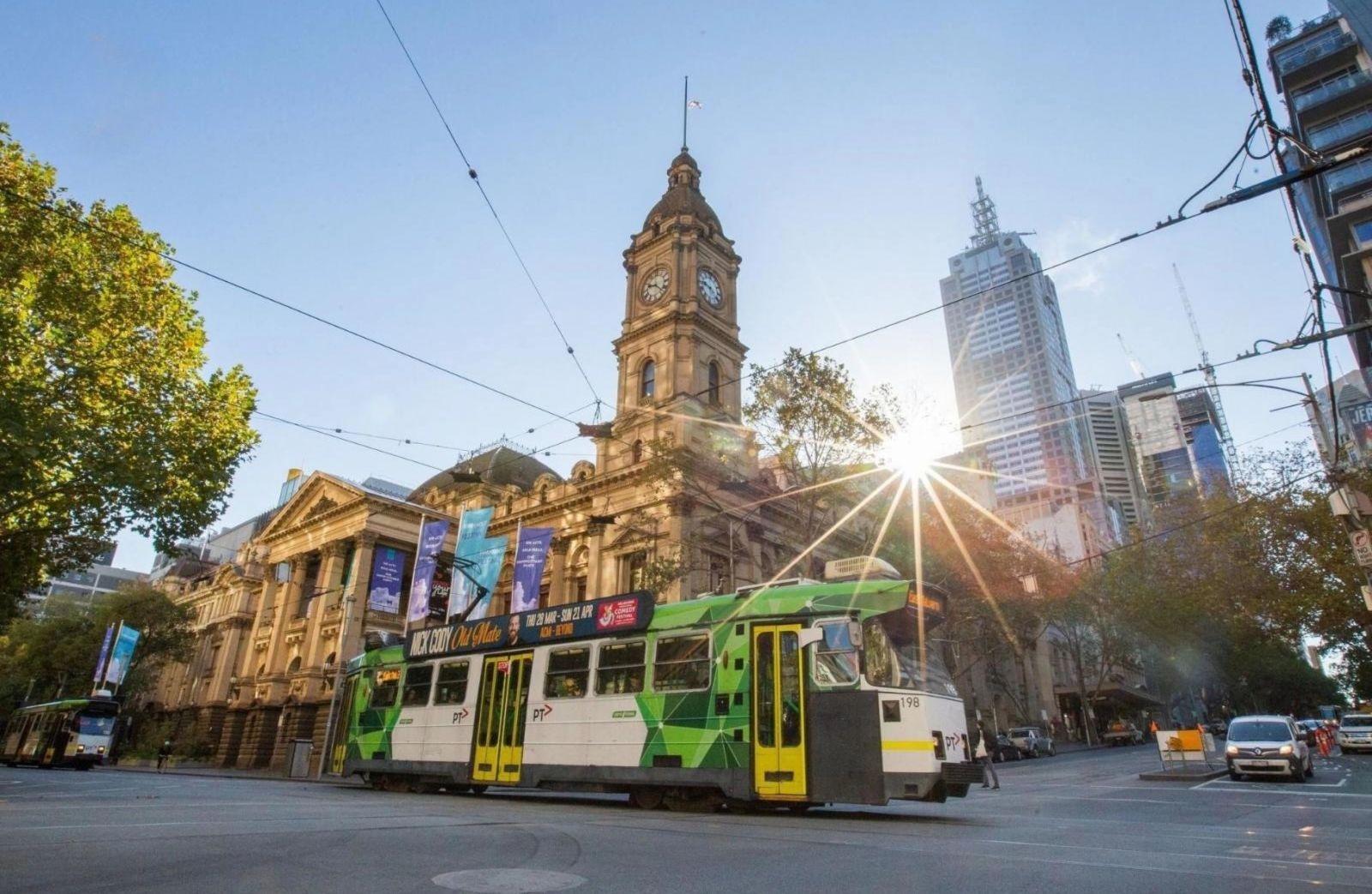 A Melbourne city scene including a tram illustrates a report on the Melbourne house and apartment in 2023.

